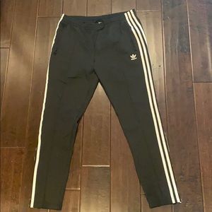 Women’s adidas SST track pants.